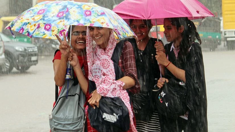 Girls hold umbrellas as they walk down a road amid rainfall during ongoing monsoon season, in Gurugram on Thursday. Girls hold umbrellas as they walk down a road amid rainfall during ongoing monsoon season, in Gurugram on Thursday.