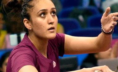 Table tennis player Manika Batra in action during her singles match at the 36th National Games, at Indoor Stadium, in Surat on Friday. Table tennis player Manika Batra