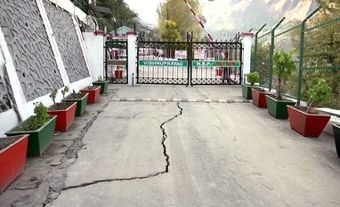 Badrinath National Highway develops cracks as Joshimath crisis intensifies Cracks appeared in an area due to landslides, in Joshimath on Saturday.