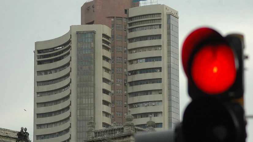 A traffic signal in front of the BSE building. BSE, NSE, Sensex, Nifty, stock markets