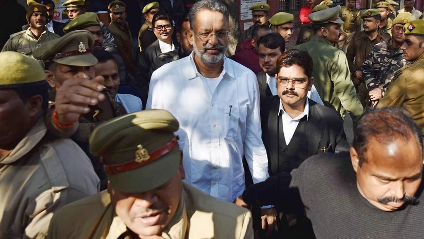 Gangster-turned-politician Mukhtar Ansari (Photo: ANI) Gangster-turned-politician Mukhtar Ansari is being produced in a district court in a money laundering case, in Prayagraj on Wednesday.