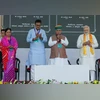 Prime Minister Narendra Modi unveils various development projects worth over Rs 7,000 crores during a public meeting, in Chittorgarh on Monday. Union Minister Arjun Ram Meghwal and BJP leader Vasundhara Raje also seen.  (Photo: ANI)