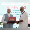 Prime Minister Narendra Modi being presented with a memento by Union Jal Shakti Minister Gajendra Singh Shekhawat during the dedication and foundation stone laying of various projects, in Jodhpur on Thursday. (Photo: ANI) Prime Minister Narendra Modi being presented with a memento by Union Jal Shakti Minister Gajendra Singh Shekhawat during the dedication and foundation stone laying of various projects, in Jodhpur on Thursday. (Photo: ANI)