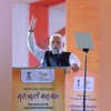 Prime Minister Narendra Modi addresses a gathering during the concluding ceremony of the 'Meri Maati Mera Desh-Amrit Kalash Yatra', at Kartavya Path, in New Delhi on Tuesday. (
