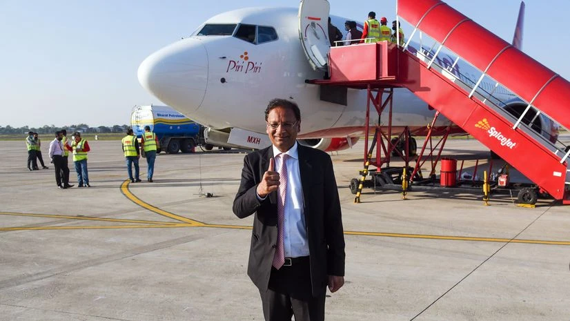 SpiceJet Chairman Ajay Singh poses for the photo in front of in front of Boeing 737 max SpiceJet (Photo: ANI) SpiceJet Chairman Ajay Singh poses for the photo in front of in front of Boeing 737 max SpiceJet (Photo: ANI)